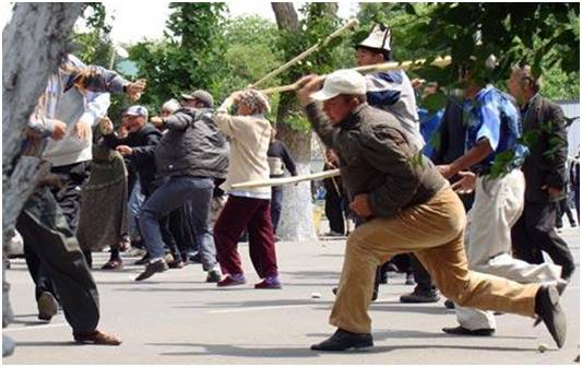 People fight during a rally in Kyrgyz's town Jalalabad 
